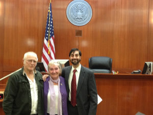 Shahid Haque-Hausrath with his client, Andrea Carlson, after she took her oath of allegiance to the United States.